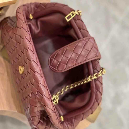 Burgundy clutch with golden strap